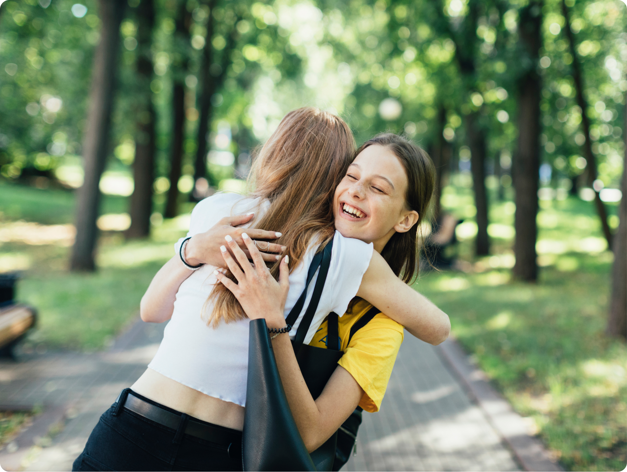 Two happy students hugging