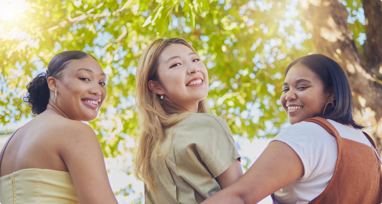 Three diverse happy women